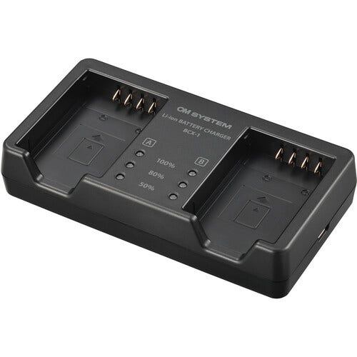 OM SYSTEM SBCX-1 battery and dual charger set.