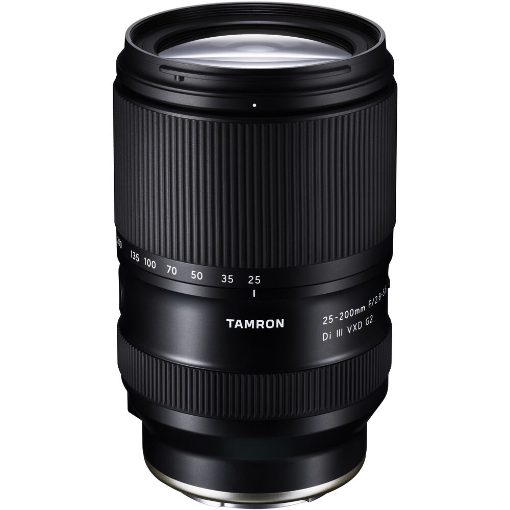 Black Tamron 25-200mm lens standing upright, front three-quarter view, on a white background