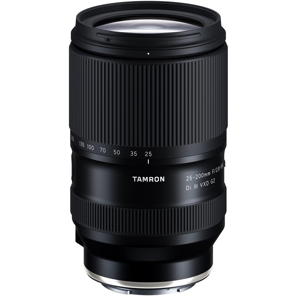Black Tamron 25-200mm lens standing upright, front three-quarter view, on a white background