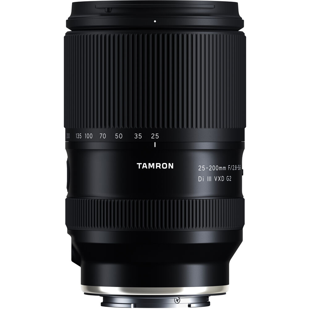 Black Tamron 25-200mm lens standing upright, front three-quarter view, on a white background