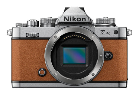 Nikon Z fc mirrorless camera in amber brown with two zoom lenses