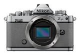 Nikon Z fc mirrorless camera in natural grey with two zoom lenses