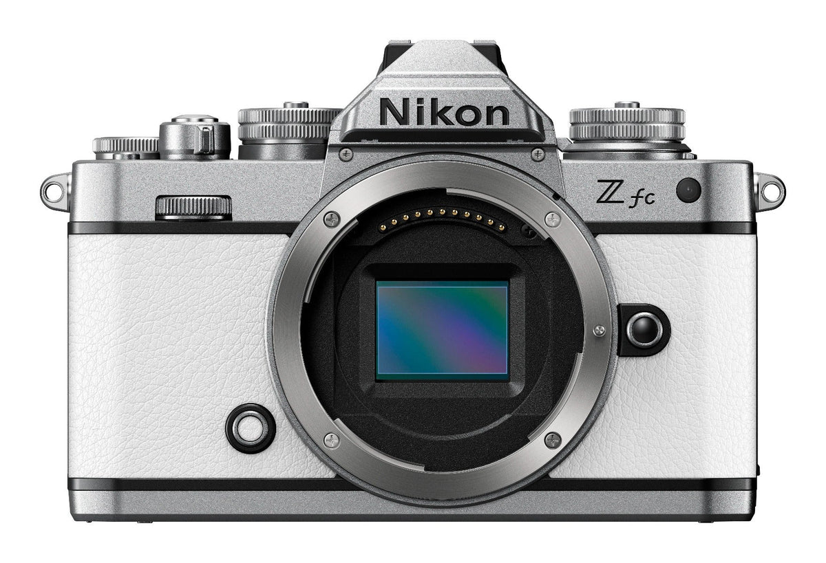 Nikon Z fc mirrorless camera in white with two zoom lenses