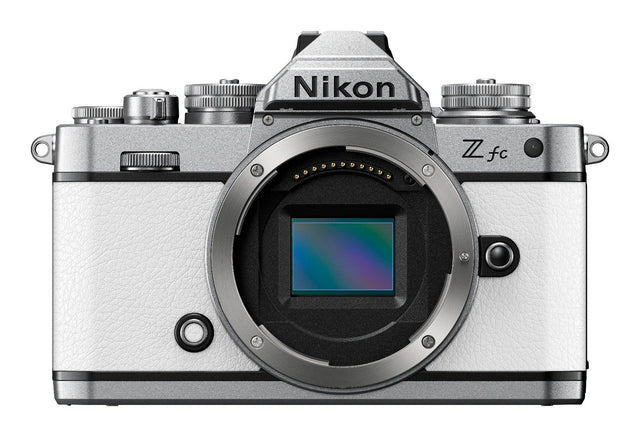Nikon Z fc mirrorless camera in white with two zoom lenses