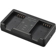 OM SYSTEM SBCX-1 battery and dual charger set.