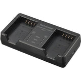 OM SYSTEM SBCX-1 battery and dual charger set.