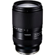 Black Tamron 25-200mm lens standing upright, front three-quarter view, on a white background