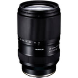 Black Tamron 25-200mm lens standing upright, front three-quarter view, on a white background