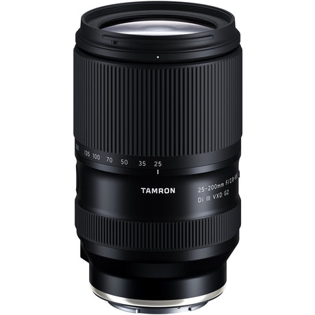 Black Tamron 25-200mm lens standing upright, front three-quarter view, on a white background