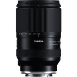 Black Tamron 25-200mm lens standing upright, front three-quarter view, on a white background