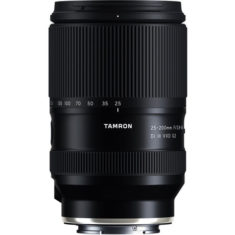 Black Tamron 25-200mm lens standing upright, front three-quarter view, on a white background