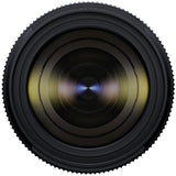Black Tamron 25-200mm lens standing upright, front three-quarter view, on a white background