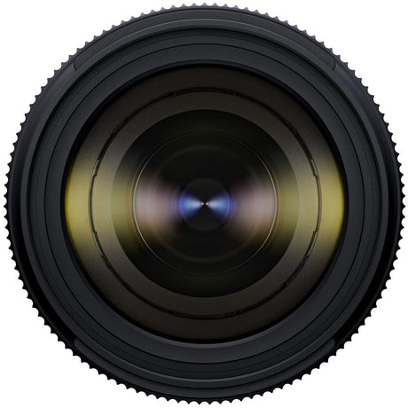 Black Tamron 25-200mm lens standing upright, front three-quarter view, on a white background