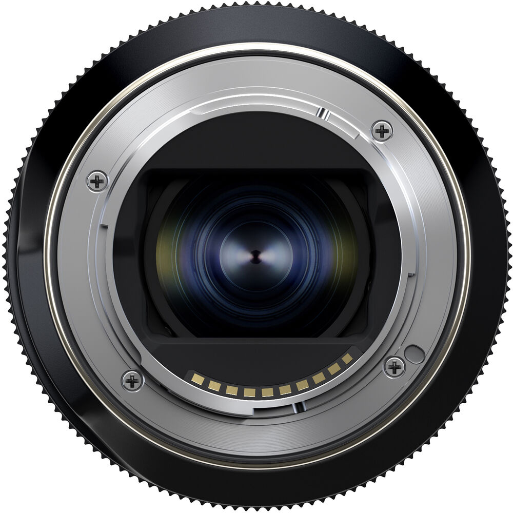 Black Tamron 25-200mm lens standing upright, front three-quarter view, on a white background